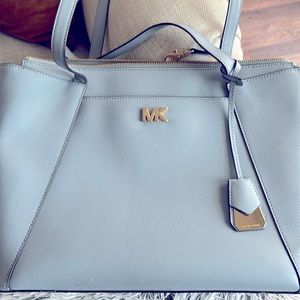 Really good condition. Small smudge by logo. Dust bag included.